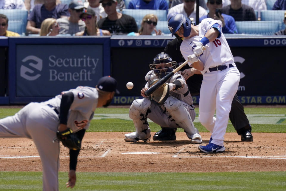 Los Angeles Dodgers' Will Smith, right, hits an RBI single as Detroit Tigers starting pitcher Eduardo Rodriguez, left, and catcher Tucker Barnhart watch during the first inning of a baseball game Sunday, May 1, 2022, in Los Angeles. (AP Photo/Mark J. Terrill)
