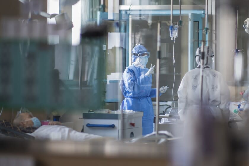 Nurses work at an ICU ward for COVID-19 patients in Wuhan.