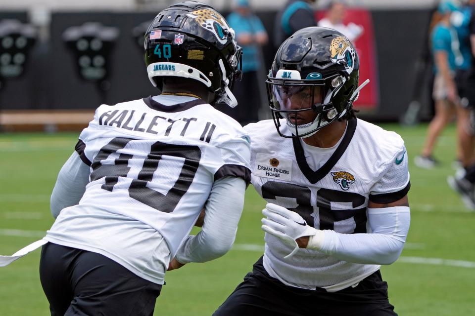 Jacksonville Jaguars cornerback Christian Braswell, right, goes against cornerback Erick Hallett II (40) during an NFL football rookie camp, Friday, May 12, 2023, in Jacksonville, Fla. (AP Photo/John Raoux)