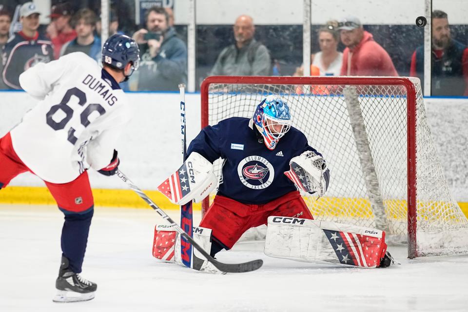 Jul 2, 2023; Columbus, Ohio, USA;  Goaltender Pavel Cajan (30) deflects a shot from forward Jordan Dumais (69) during the Columbus Blue Jackets development camp at the OhioHealth Chiller North in Lewis Center. 