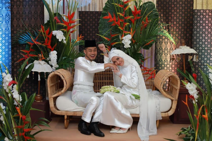 The elated groom and beautiful bride