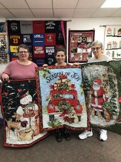 Three generations stand together at Coburn's Quilting Plus in Barberton. From left, Martine Wilson, Wilson's daughter Stephanie Moore, and Joyce Coburn, Wilson's mother and Moore's grandmother. Coburn's mother started the Barberton business with a friend.