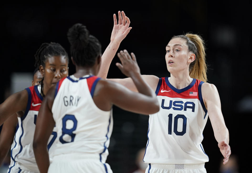 United States' Breanna Stewart (10), right, celebrates with teammates after their win in the women's basketball preliminary round game against Japan at the 2020 Summer Olympics, Friday, July 30, 2021, in Saitama, Japan. (AP Photo/Charlie Neibergall)