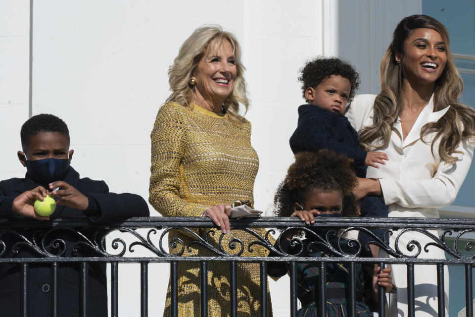 First lady Jill Biden, singer Ciara Princess Wilson, right, with her children Future Zahir, 7, Sienna Princess, 4, and Win Harrison Wilson, 1, watch from the White House balcony as President Joe Biden, leave the White House on Marine One, Wednesday, Nov. 17, 2021, in Washington. Biden is traveling to visit the General Motors' electric vehicle assembly plant in Detroit. (AP Photo/Manuel Balce Ceneta)