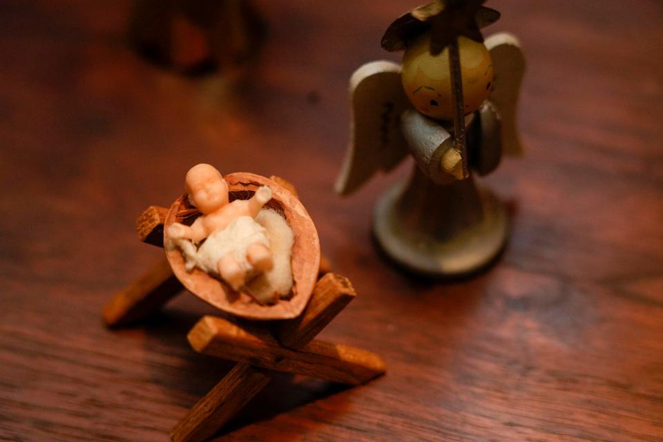 Diane Evans has had these Christmas decorations for more than 60 years. Baby Jesus is nestled in a walnut shell and looked over by an angel.