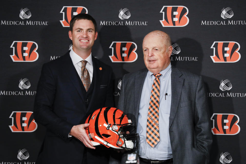 Cincinnati Bengals football head coach Zac Taylor, left, and Bengals owner Mike Brown, right, pose for a photograph during a news conference, Tuesday, Feb. 5, 2019, in Cincinnati. After 16 years without a playoff win under Marvin Lewis, the Bengals decided to try something different. But they had to wait more than a month before hiring Zac Taylor as their next coach in hopes of ending a long streak of futility. (AP Photo/John Minchillo)