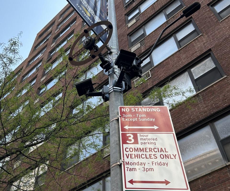 a street sign is posted on a pole