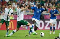 POZNAN, POLAND - JUNE 18: Mario Balotelli of Italy is tackled by Sean St Ledger of Republic of Ireland during the UEFA EURO 2012 group C match between Italy and Ireland at The Municipal Stadium on June 18, 2012 in Poznan, Poland. (Photo by Claudio Villa/Getty Images)