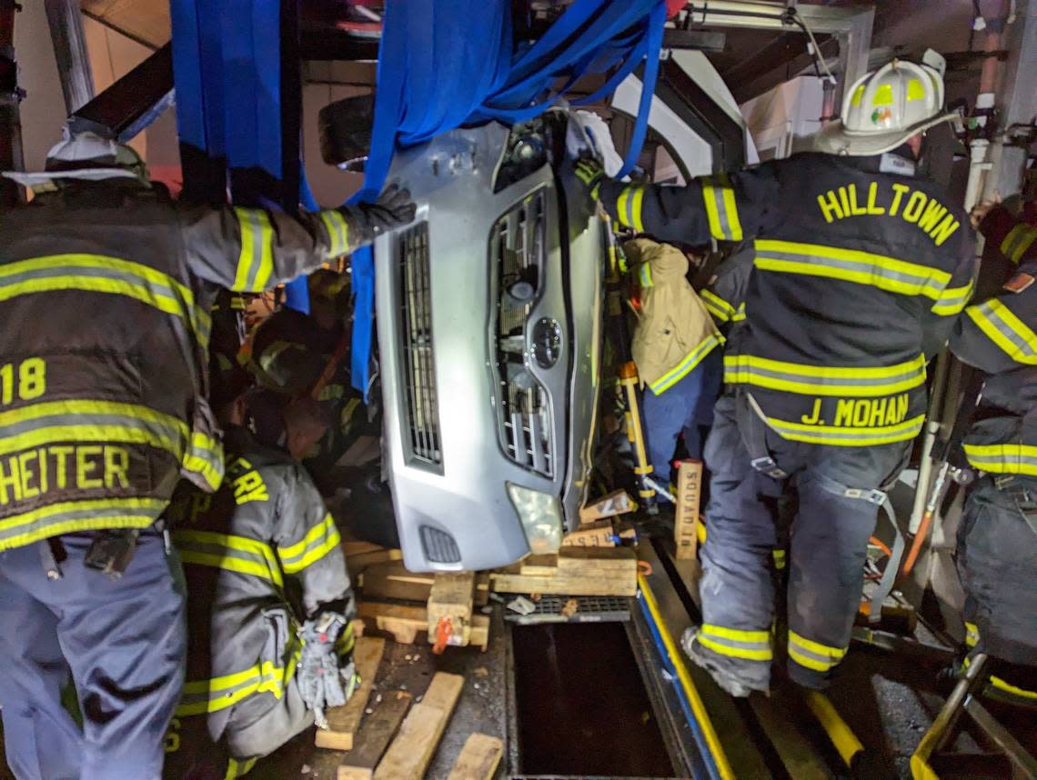 Firefighters rescued a driver whose car overturned in a Pennsylvania car wash, officials say.