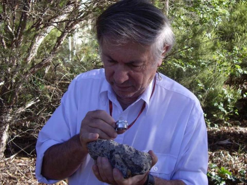 Andrew Glikson with a sample of suevite – a rock with partially melted material formed during an impact (D Seymour)