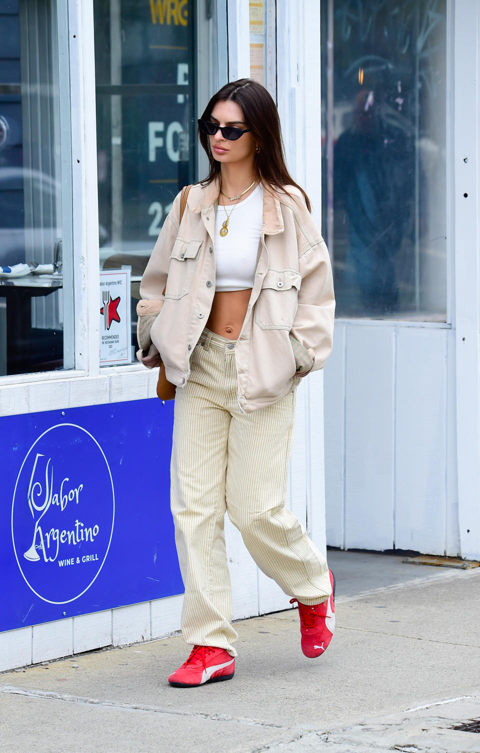 Emily Ratajkowski is seen on April 17, 2024 in New York City wearing Puma Speedcat LS sneakers