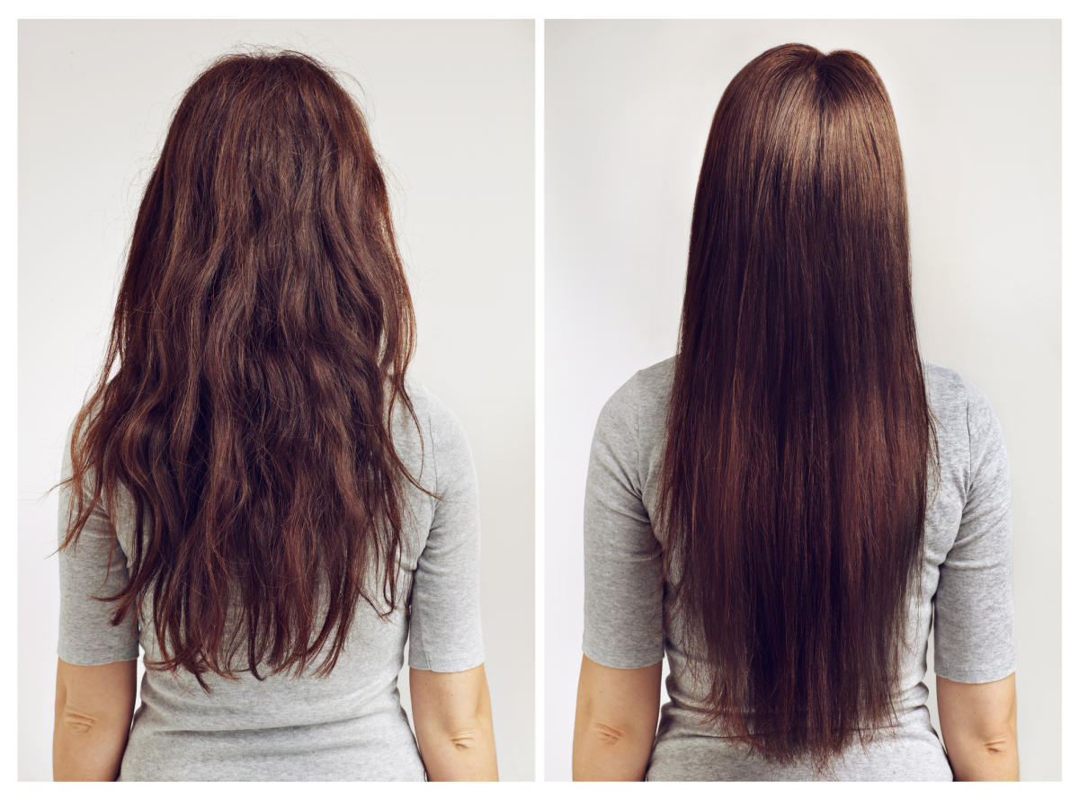 Girl with brown hair, clear skin in white shirt stands straight