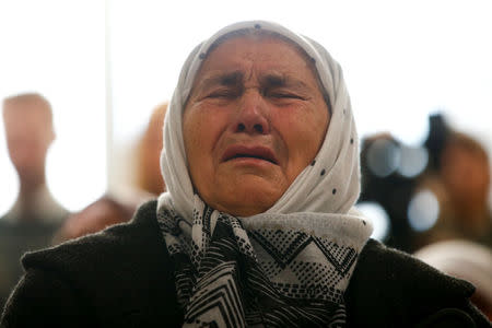 A woman reacts as she watches a television broadcast of the court proceedings of former Bosnian Serb general Ratko Mladic in the Memorial centre Potocari near Srebrenica, Bosnia and Herzegovina, November 22, 2017. REUTERS/Dado Ruvic