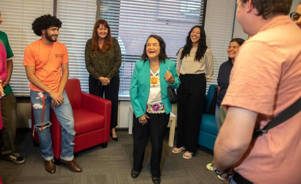 Farm labor activist Dolores Huerta, center, visits with some of the university's Community Involvement Program students at the Center for Identity and Inclusion on the UOP campus in Stockton on Thursday, Sept. 29, 2022.