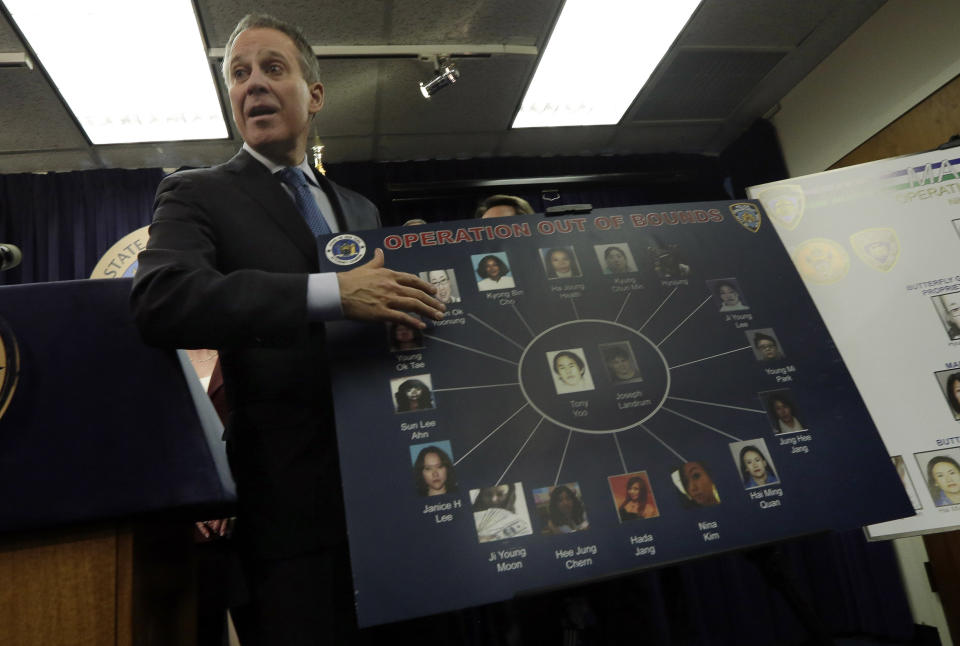 New York Attorney General Eric Schneiderman describes a chart as he addresses a news conference, in New York, Thursday, Jan. 30, 2014. Police were rounding up 18 people in New York City on Thursday on allegations they sold "party packs" of cocaine and sex to high-end clients and texted their customers to advertise ahead of this week's Super Bowl festivities. (AP Photo)