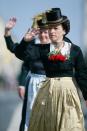 A woman dressed in a Northern German costume participates in the riflemen's parade.