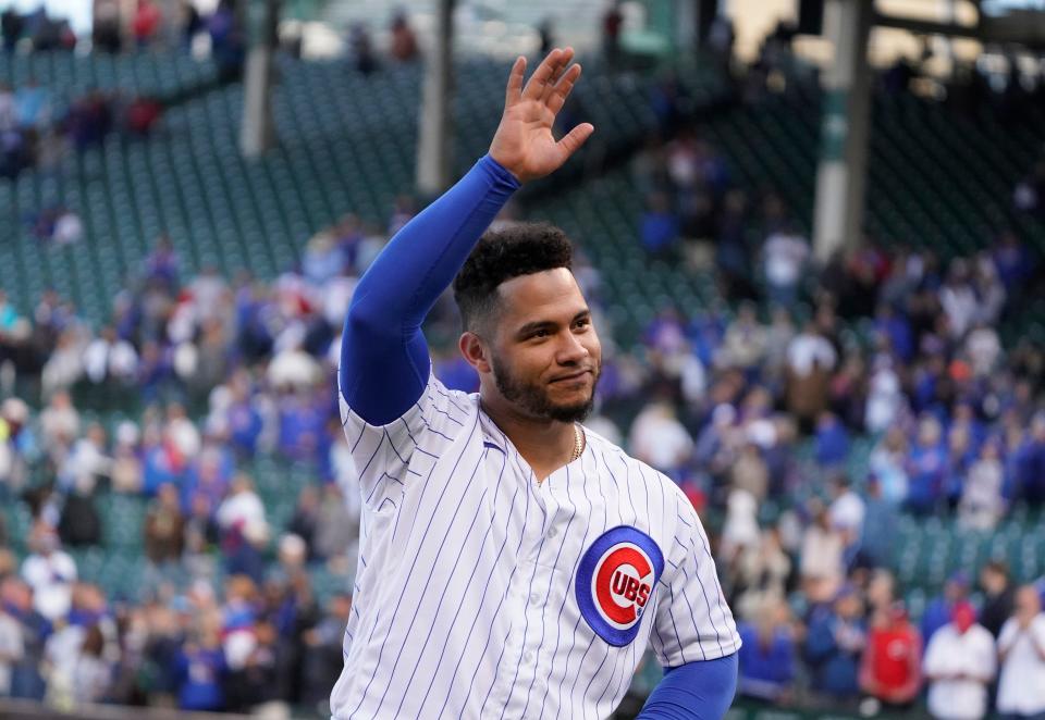 Catcher Willson Contreras says goodbye to the fans at Wrigley Field after the Cubs' season finale. He played seven seasons in Chicago before becoming a free agent.