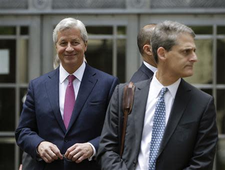 J.P. Morgan CEO Jamie Dimon (L) leaves the U.S. Justice Department after meeting with Attorney General Eric Holder, in Washington September 26, 2013. REUTERS/Gary Cameron