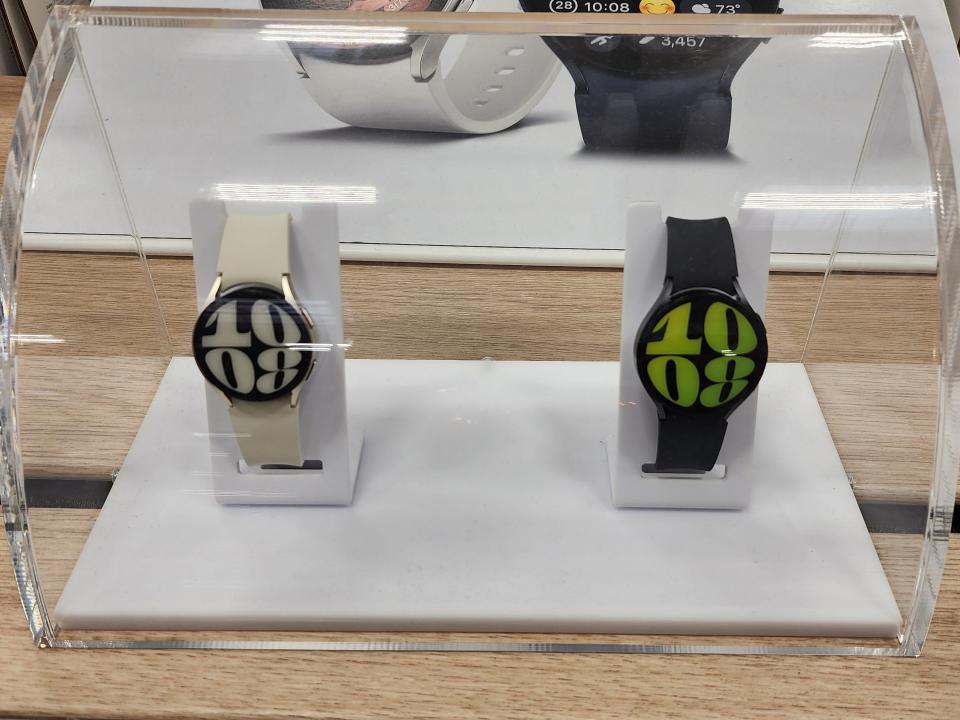 White and black Galaxy watches in display case at Costco