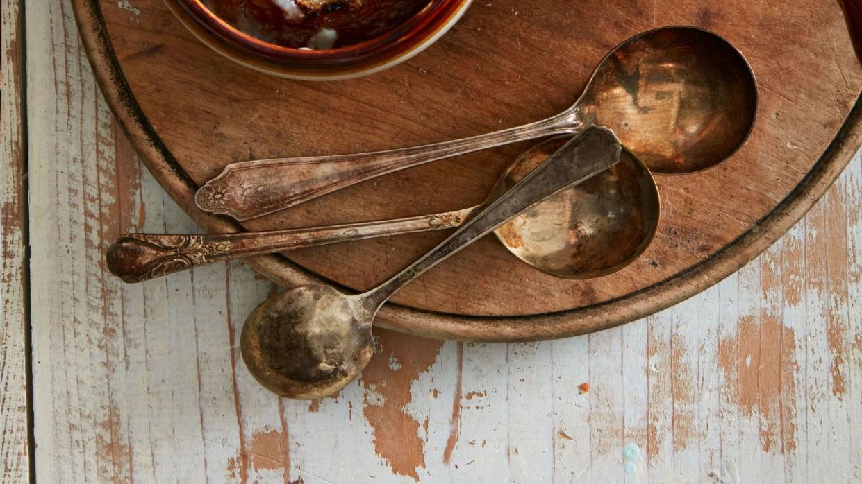 french onion soup in soup crocks with spoons