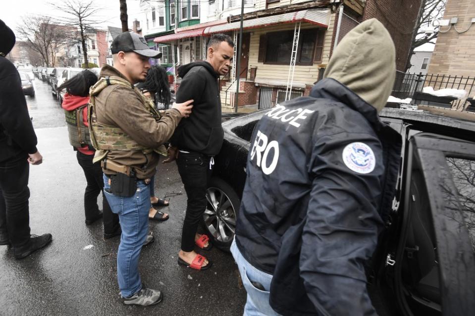 Federal agents raid a home in the Bronx allegedly taken over by squatters. Matthew McDermott