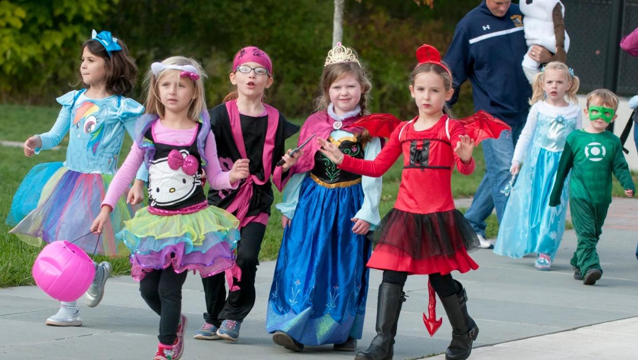 Costumed children march in the annual Hanover Woman's Club Halloween parade in 2014.