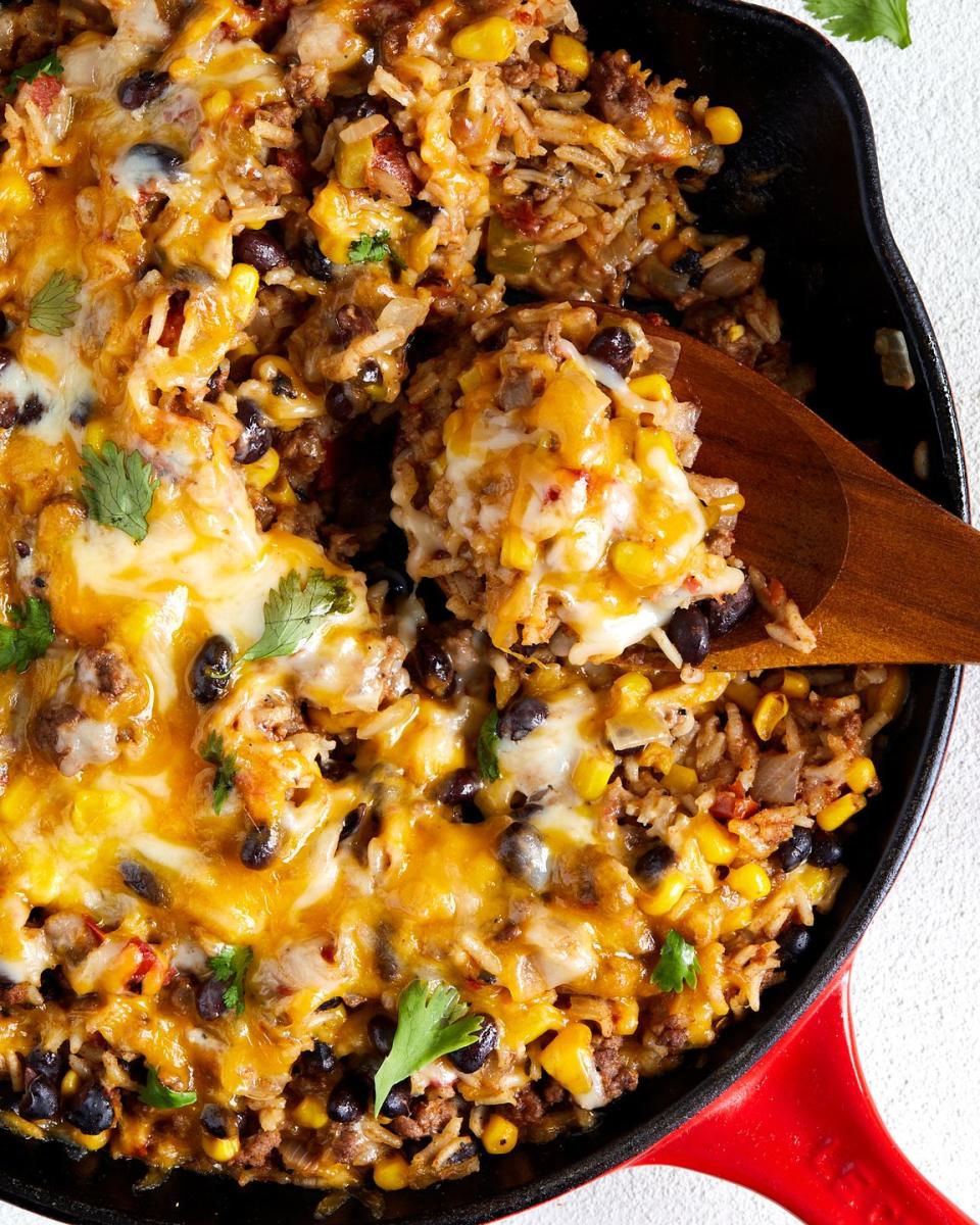 mexican beef 'n rice skillet topped with melty cheese and cilantro