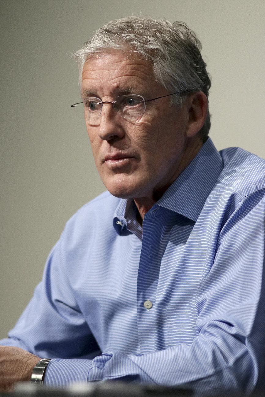 Seattle Seahawks NFL football head coach Pete Carroll talks to the media during a news conference Friday, April 4, 2014, in Renton, Wash. The Seahawks have locked up coach Carroll with a three-year contract extension after he led the franchise to its first Super Bowl title. (AP Photo/Marcus R. Donner)