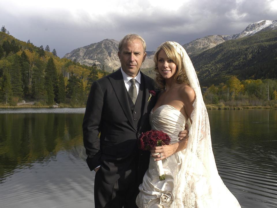 Actor Kevin Costner poses with his new wife Christine Baumgartner during their private wedding at his ranch in September 25, 2004 in Aspen, Colorado.