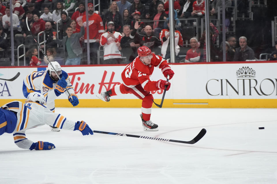 Detroit Red Wings left wing Lucas Raymond (23) scores on an empty net against the Buffalo Sabres in the third period of an NHL hockey game Saturday, March 16, 2024, in Detroit. (AP Photo/Paul Sancya)