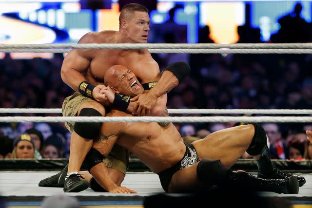 Mel Evans/AP/Shutterstock John Cena and Dwayne "The Rock" Johnson had a long wrestling rivalry that saw them battle it out on several occasions.