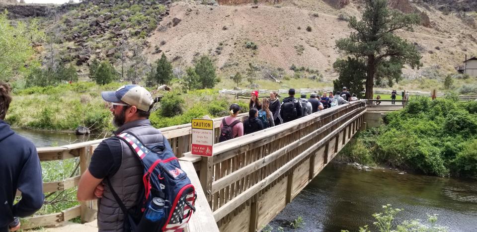 Hikers crossing a bridge at Smith Rock State Park in Central Oregon on a recent weekend didn't always maintain adequate social distancing without wearing masks.