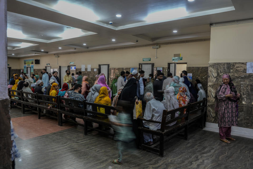 People wait inside the outpatient department (OPD) at a mental health hospital in Srinagar, Indian controlled Kashmir, Tuesday, Aug 1, 2023. Kashmir's mental healthcare clinics depict invisible scars of decades of violent armed insurrections, brutal counterinsurgency, unparalleled militarization, unfulfilled demands for self-determination have fueled depression and drugs in the disputed region, experts say. (AP Photo/Mukhtar Khan)