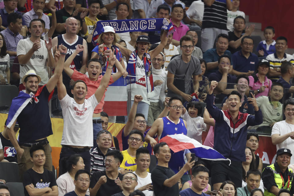 Supporters for France cheer during a quarterfinal match against United States for the FIBA Basketball World Cup in Dongguan in southern China's Guangdong province on Wednesday, Sept. 11, 2019. France defeated United States 89-79. (AP Photo/Ng Han Guan)