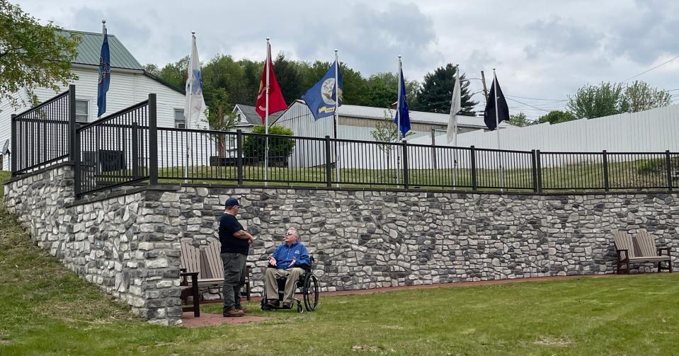 Sam Bartko, left, and Jim Marker talk after the grant awards announcement in the Rockwood Veterans Memorial and Community Park.