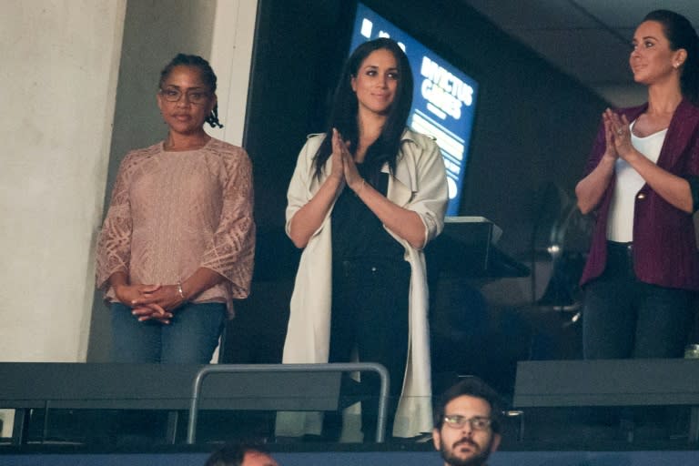 Meghan Markle is likely to be walked down the aisle with her mother Doria Ragland, seen here to her left