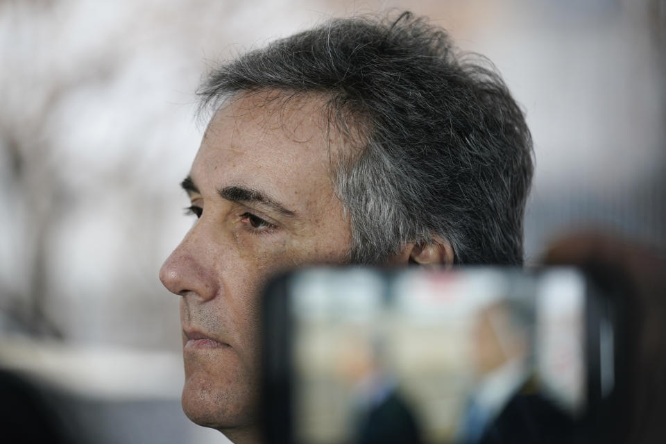 Michael Cohen talks to reporters as he arrives to testify before a grand jury in New York, Monday, March 13, 2023. (AP Photo/Seth Wenig)