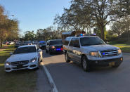 <p>Police and security vehicles are seen at Marjory Stoneman Douglas High School in Parkland, Florida, a city about 50 miles (80 kilometers) north of Miami on Feb. 14, 2018 following a school shooting.<br> (Photo: Michele Eve Sandberg/AFP/Getty Images) </p>