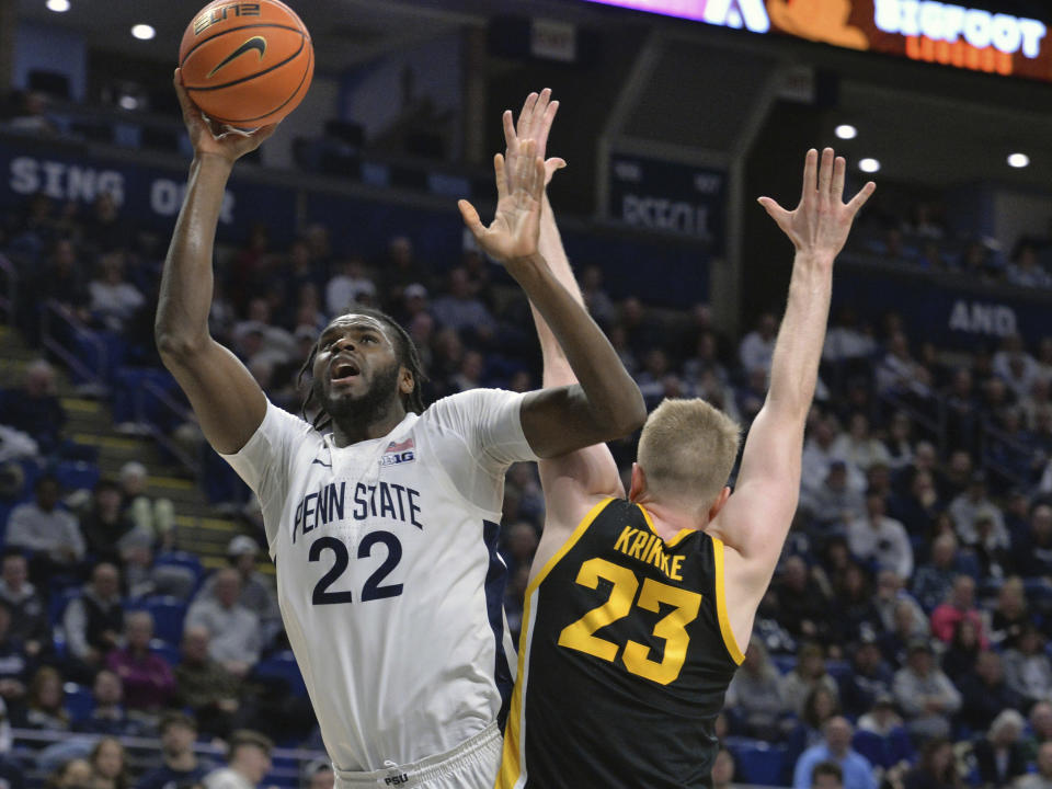 Penn State's Qudus Wahab (22) shoots next to Iowa's Ben Krikke (23) during the first half of an NCAA college basketball game Thursday, Feb. 8, 2024, in State College, Pa. (AP Photo/Gary M. Baranec)