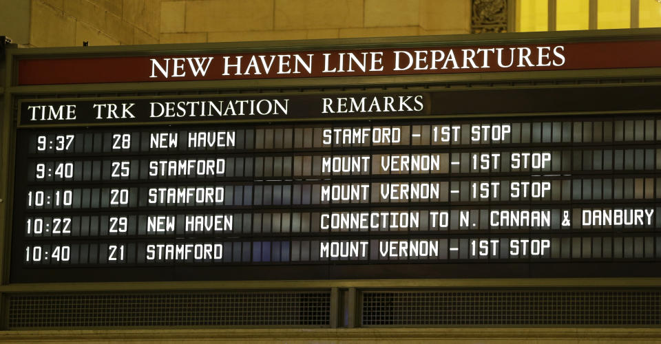 It's a well-kept secret that the departure times on the board in of Grand Central Terminal's main concourse are posted one minute earlier than the trains actually leave to make sure passengers are board in time for the train's departure in New York, Tuesday, Jan. 8, 2013. The country's most famous train station and one of the finest examples of Beaux Arts architecture in America turns 100 on Feb. 1. (AP Photo/Kathy Willens)