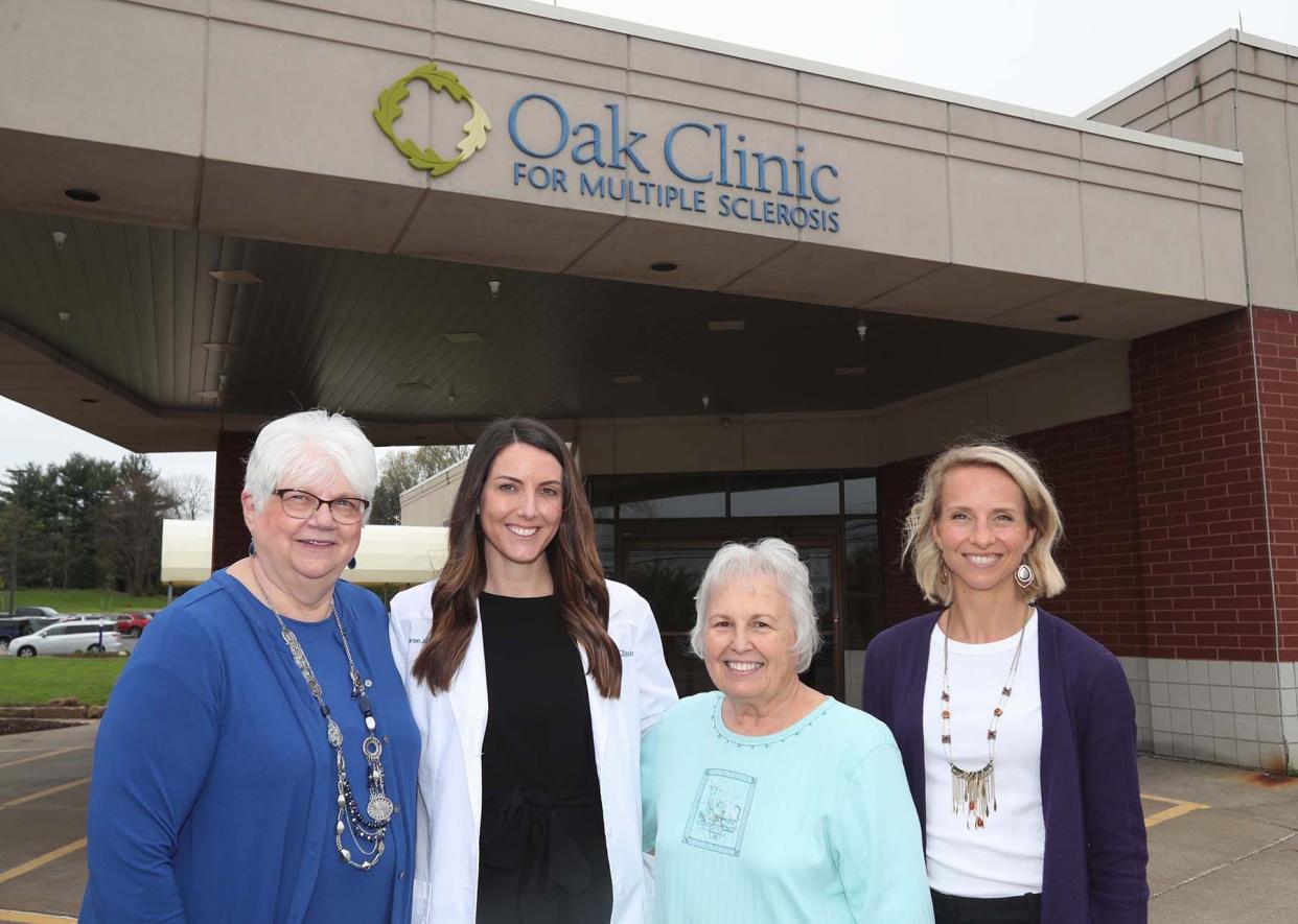 Sue Arnold, left, the development director of the Oak Clinic for Multiple Sclerosis, certified nurse practitioner Lauren Junk, patient Elaine Reiter and registered dietician Chelsey Jackson stand in front of the clinic. The clinic recently got a national grant to help with its Wellness Wednesday program that has helped many patients, including Reiter, manage their MS symptoms.
