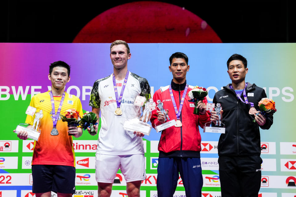 TOKYO, JAPAN - AUGUST 28: (L-R) Kunlavut Vitidsarn of Thailand, Viktor Axelsen of Denmark, Zhao Junpeng of China and Chou Tien Chen of Chinese Taipei pose with their medals on the podium after the Men's Single Final match on day seven of the BWF World Championships at Tokyo Metropolitan Gymnasium on August 28, 2022 in Tokyo, Japan. (Photo by Shi Tang/Getty Images)