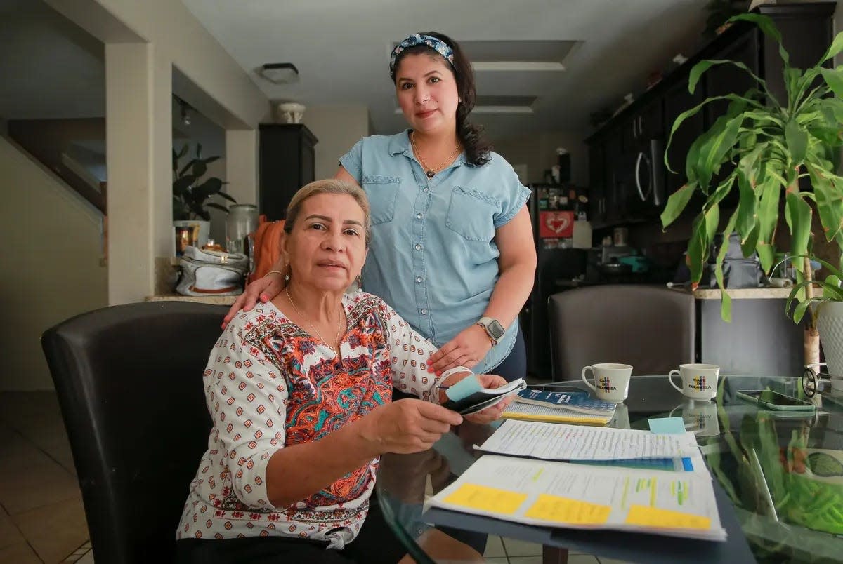 Carmen Ramirez and her daughter, Jessica Mejia in their Baytown, Texas home on August 24, 2023. Ramirez and Mejia, originally from Colombia, are pursuing US citizenship and preparing to take the naturalization test together.