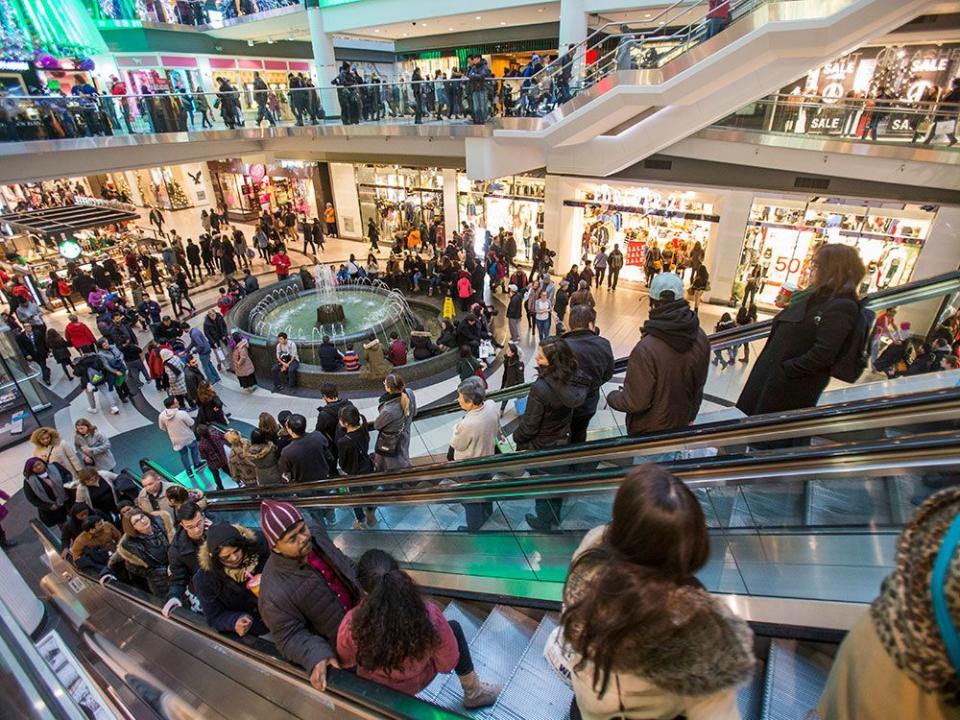  Shoppers crowd the Eaton Centre mall in Toronto. This holiday season retailers have found it difficult to find extra help to cover the rush.