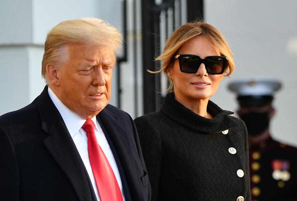 US President Donald Trump and First Lady Melania Trump make their way to board Marine One as they depart the White House in Washington, DC, on January 20, 2021. - President Trump travels to his Mar-a-Lago golf club residence in Palm Beach, Florida, and will not attend the inauguration for President-elect Joe Biden. (Photo by MANDEL NGAN / AFP) (Photo by MANDEL NGAN/AFP via Getty Images)