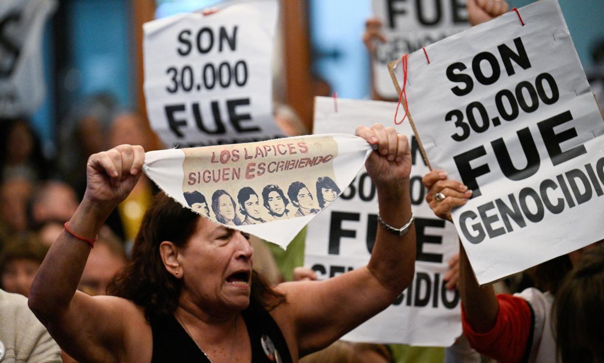 <span>Families of the victims uotside court in La Plata on Tuesday.</span><span>Photograph: Luis Robayo/AFP/Getty Images</span>