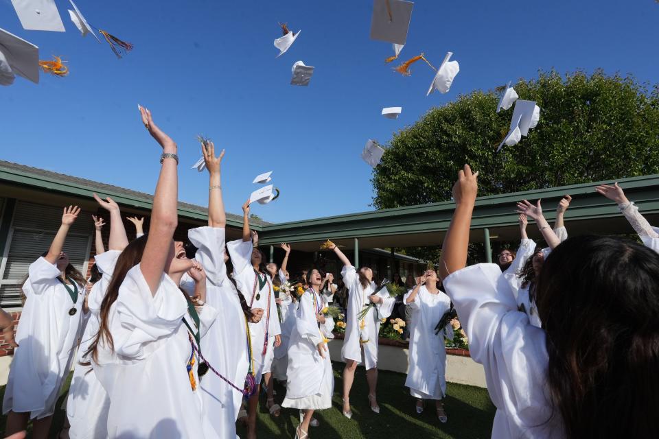 After the final graduation at La Reina High School, students celebrate on their Thousand Oaks campus on Friday.