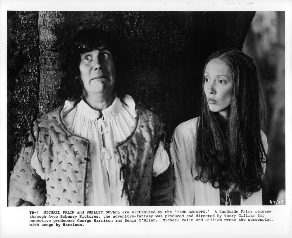 Michael Palin and Shelley Duvall look to their right in a scene from the film 'Time Bandits', 1981. (Photo by AVCO Embassy Pictures/Getty Images)