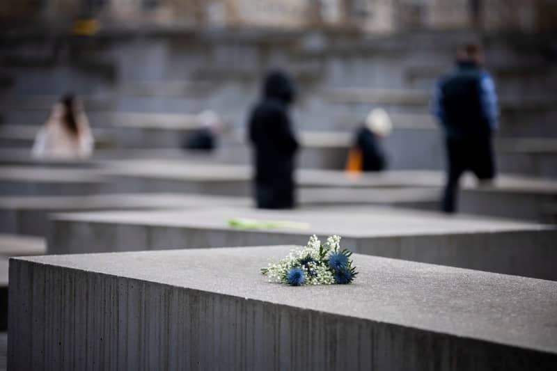 Flowers lie on a stele at the Memorial to the Murdered Jews of Europe to mark the International Day of Commemoration in Memory of the Victims of the Holocaust. Christoph Soeder/dpa