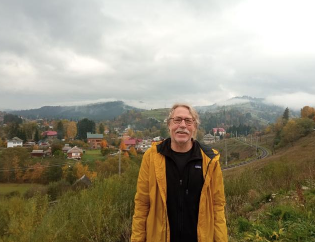 In between volunteering with war-aid organizations, teaching at a Ukrainian university and talking with locals, Bob Wood said he also got to explore the scenic beauty of Ukraine in 2022. Here, the Muskegon teacher stands in front of the settlement Vorokhta, in the Carpathian Mountains.